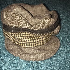 Multi patterned brown hat with floral decal